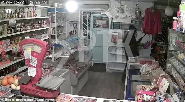 Footage captured the heartbreaking moment he raised his gun before the shopkeeper came out