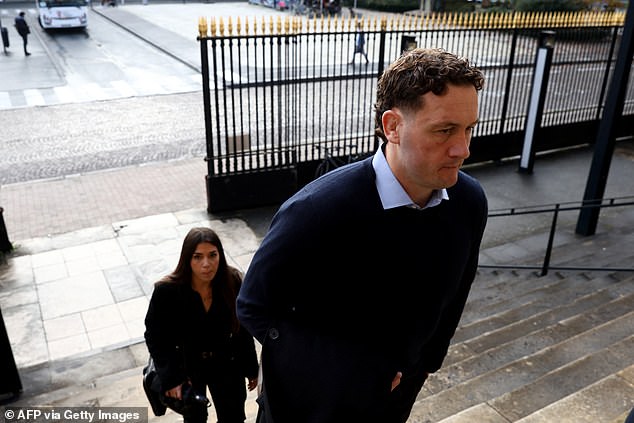 New Zealand rugby player Rory Grice (right), accused of gang rape, arrives for his trial at the courthouse in Bordeaux, southwestern France, on December 2, 2024.