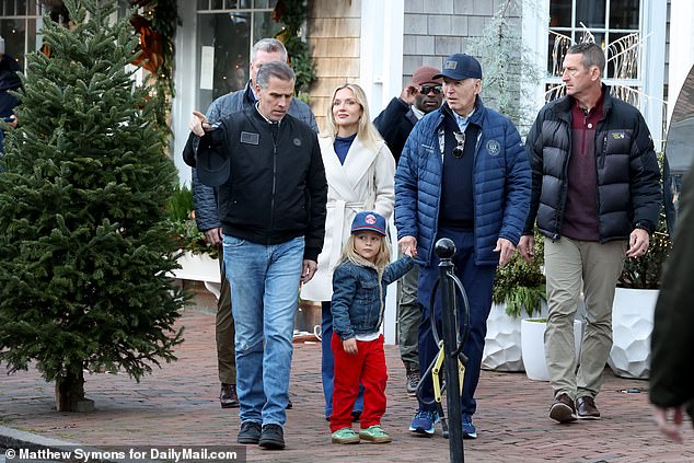 Baby Beau guides President Joe Biden as he shops in Nantucket as Hunter Biden walks with them