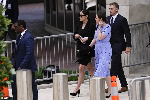 Naomi Biden (left), with her husband Peter Neal, leaves her father Hunter's trial in June