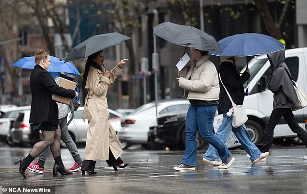 The unsettled weather patterns seen across much of northern and eastern Australia last week will continue into early December (pictured, wet weather in Melbourne)