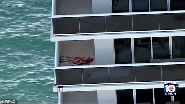 Aerial footage of blood pools on the balcony overlooking Hallandale Beach, north of Miami