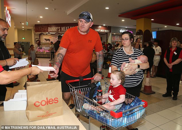 An Australian family claims their Coles voucher courtesy of Adrian Portelli