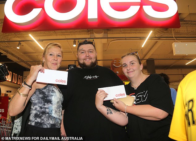 Pictured, 25-year-old Lee-Arnna Austin-Fasham (right) with her 32-year-old husband Christopher Hodges (center) and 53-year-old mother Jenni Harrison (left) got a $200 voucher.