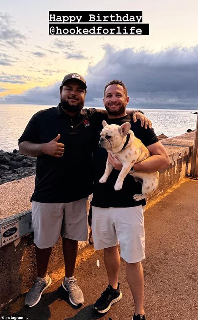 The last photo he shared was in August while posing with his partner on a catwalk with a rocky beach and a sunset behind them.