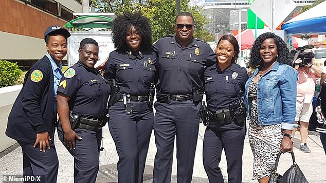 Former Miami Police Commander Weslyne Lewis Francois, third from left, appears in a photo released by the Department celebrating Black History Month.