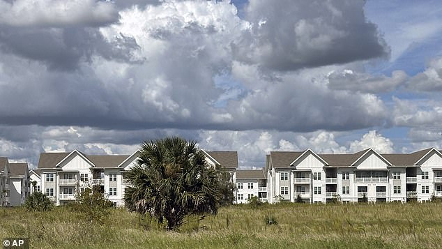 Orange groves are now being bulldozed to make way for housing and big box stores as people arrive in droves (photo: the newly built The Brightly Apartments in Haines City)