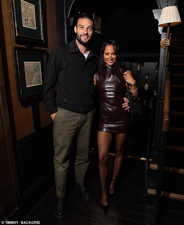 Andy and Lou hugged each other as they arrived at the swanky post-award party.