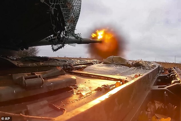 A Russian T-80BVM tank fires towards Ukrainian positions at a secret location in Ukraine last month