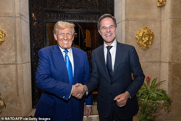 Newly elected US President Donald Trump shakes hands with NATO Secretary General Mark Rutte during their meeting in Palm-Beach, Florida on November 22