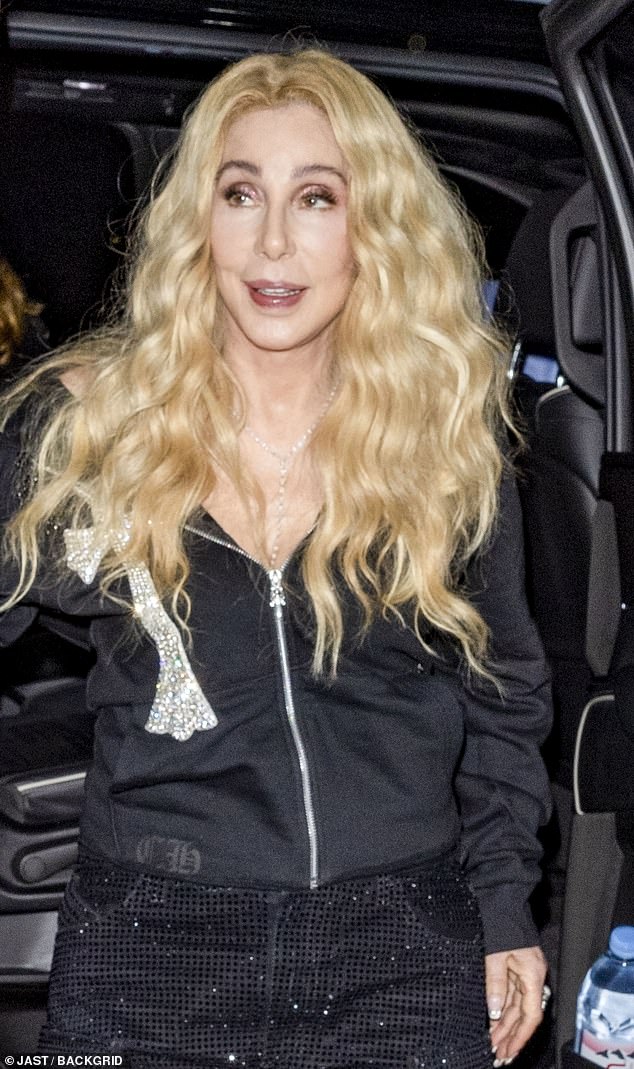 The singer, 78, turned heads as she wore her platinum blonde locks in loose waves for the evening and also sported a pair of black sequined pants.