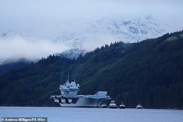 The Royal Navy aircraft carrier HMS Prince of Wales arrives at Glenmallen on Loch Long, Argyll and Bute, on 22 November.