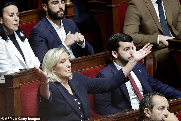 Rassemblement national parliamentary group president Marine Le Pen gestures during the voting session on the Social Security 2025 bill at the National Assembly