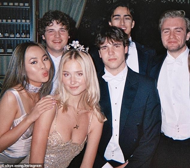 For this year's ball, Wong (left) wore a champagne-colored silk dress with ruched details and a matching choker.