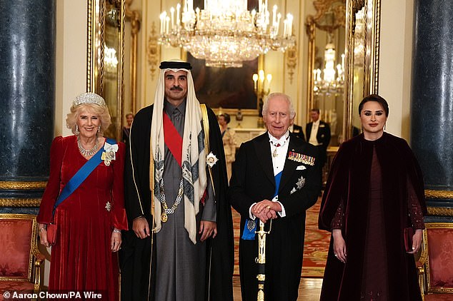 King Charles and Queen Camilla joined the Emir of Qatar and his wife for a group photo on the steps of Buckingham Palace ahead of a lavish state banquet in honor of the visiting royals.