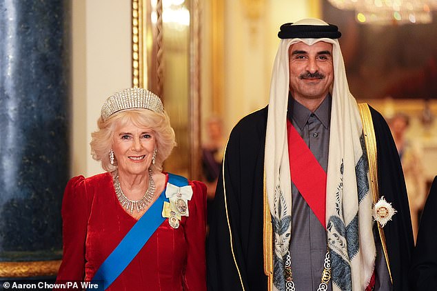 Queen Camilla poses for a photo with the Emir of Qatar