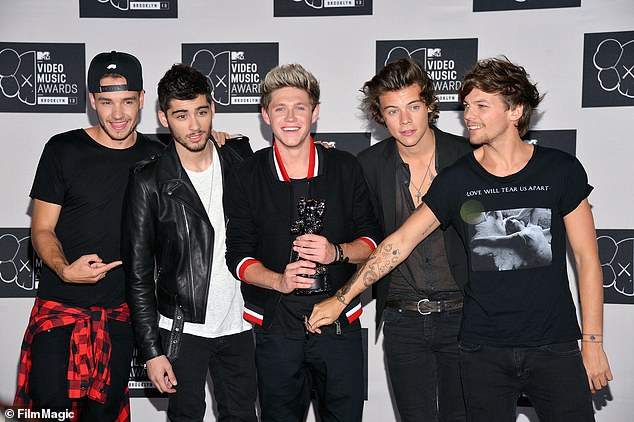 Following Liam's unexpected death at age 31 after falling from the third floor of his hotel balcony in Buenos Aires last month, Zayn announced that he would be postponing his US tour dates (One Direction pictured in 2013) .