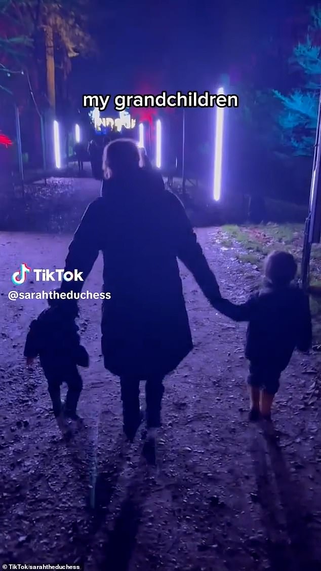 Sarah shared the 10-second clip on her social media account where she was seen enjoying a carousel ride on a 'giant rooster' and strolling among the stunning festive lights while holding hands with each grandchild.