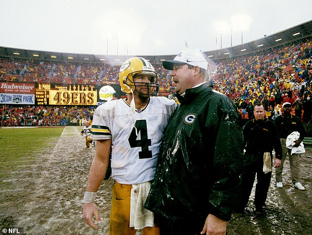 Green Bay Packers quarterback Brett Favre (4) talks with head coach Mike Holmgren as time expires in the NFC Championship Game, a 23-10 victory over the San Francisco 49ers in 1998