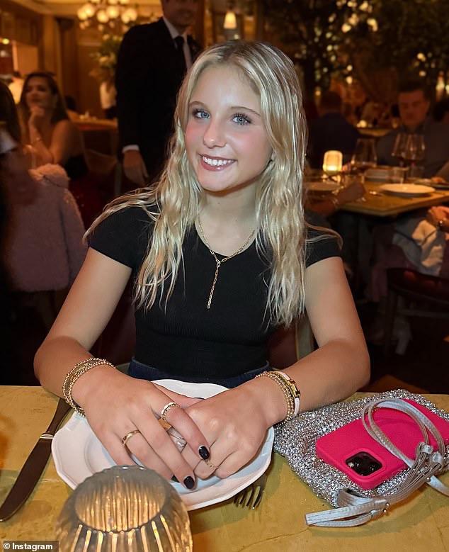 The proud mother shares a radiant snapshot of her daughter sitting at the table