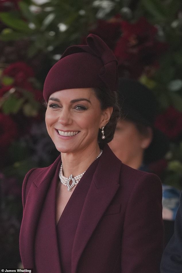 Kate's warm smile and dazzling sense of style were missed. She is pictured in a stunning burgundy ensemble for the elite occasion.