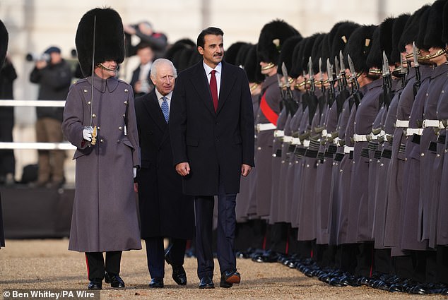 The King and Emir Sheikh Tamim bin Hamad Al Thani of Qatar inspect a guard of honor