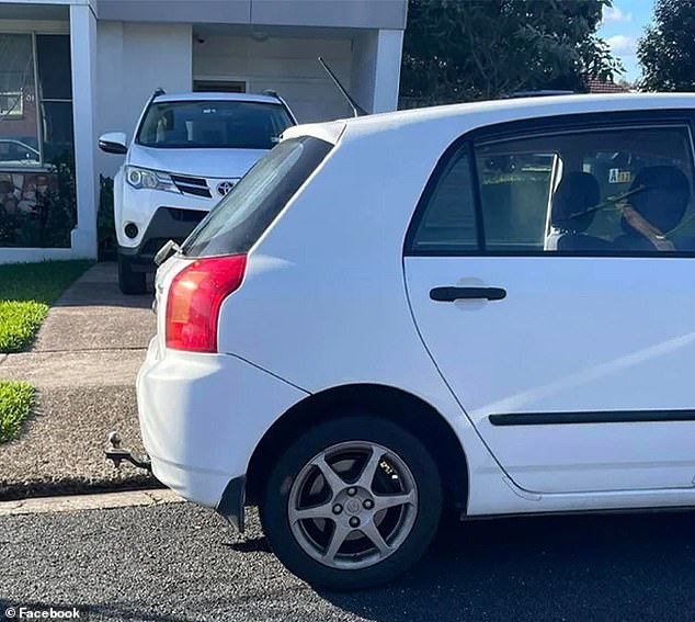 The car (pictured) was almost completely parked in a driveway in Newcastle, New South Wales, forcing a 4x4 that was visiting its elderly relative to maneuver through the narrow front yard space.