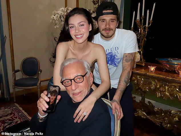 The couple posed with their father, billionaire businessman Nelson, who was on FaceTime with his brother Will.