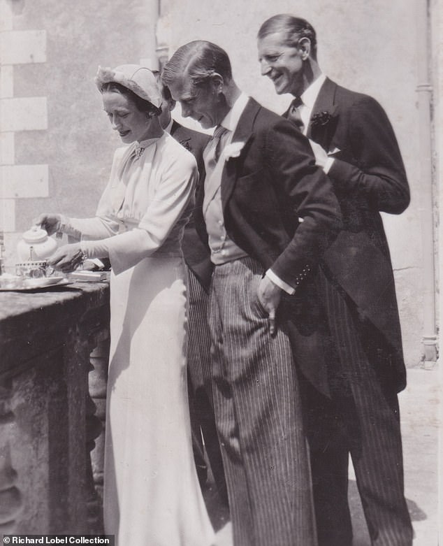 Wallis serves tea to her husband as her godfather, Major Edward 'Fruity' Metcalfe, looks on