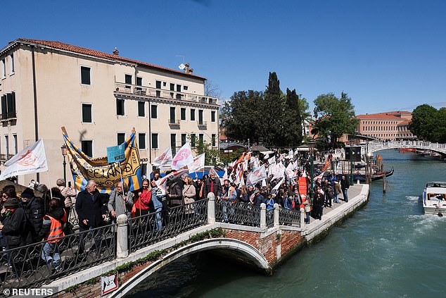 People protest against the introduction of registration and tourist tax to visit the city of Venice for day trippers on April 25