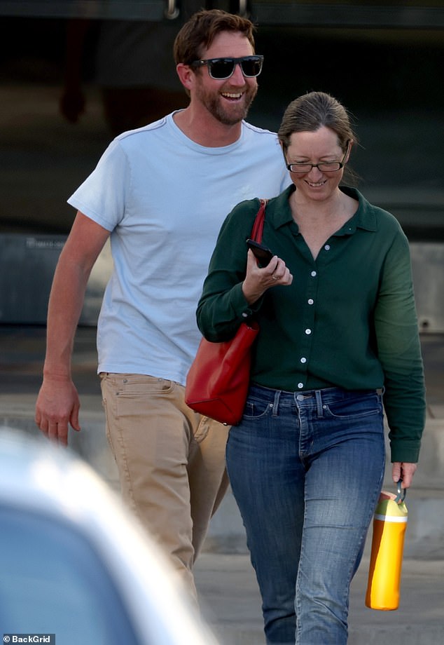 Taylor could be seen crossing a parking lot as she made her way to a parked vehicle with her husband nearby.