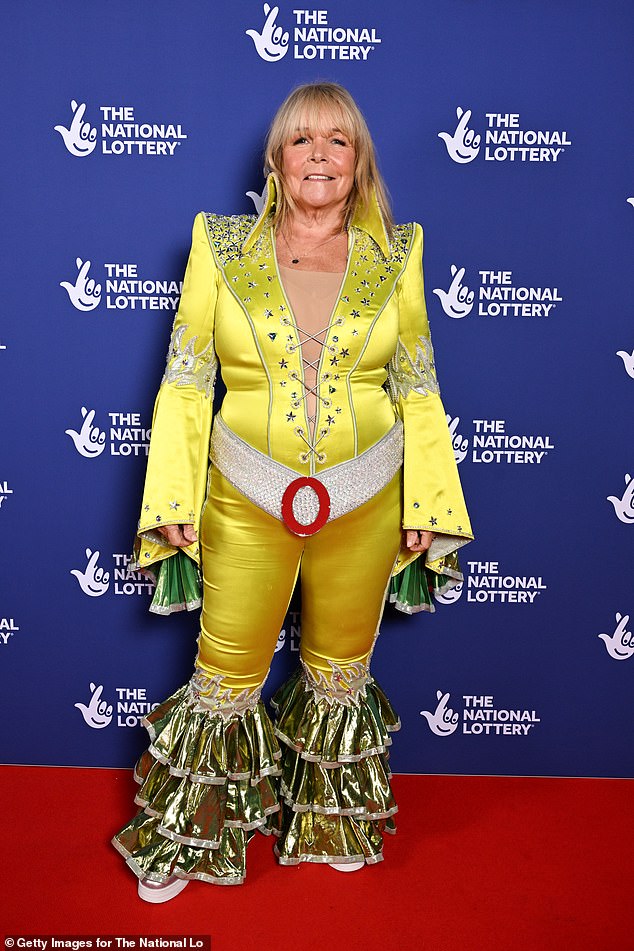 Linda, 66, dazzled in a daring yellow and silver swimsuit.