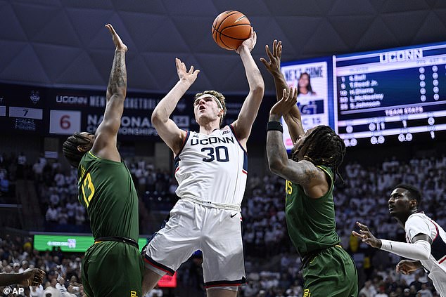 Freshman Liam McNeeley (30) led the Huskies that night with 17 points and eight rebounds.