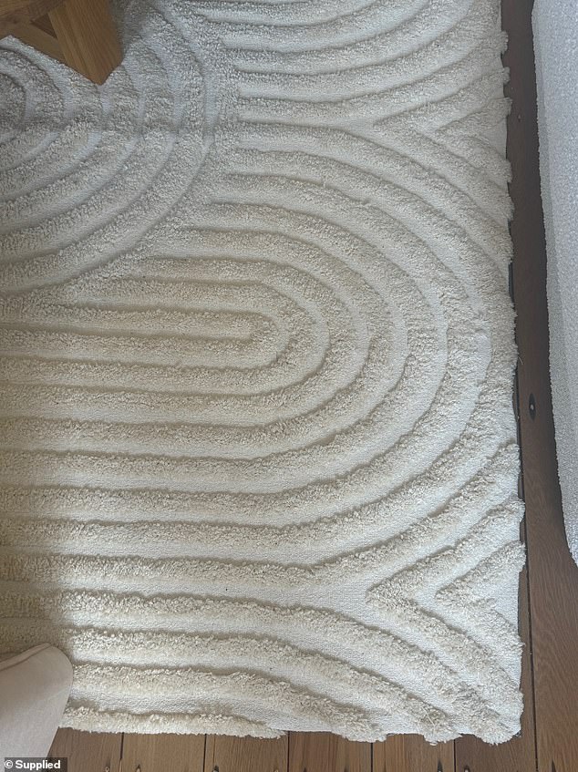 It has an embossed texture for a soft underfoot feel, carpet backing for strength and durability and is made with a blend of polyester, cotton and wool.