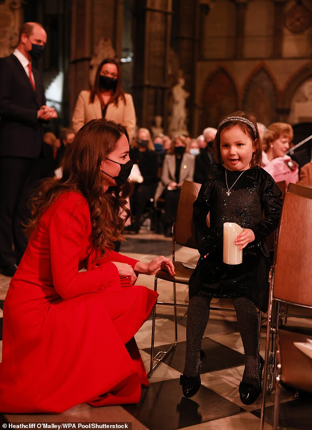 Kate talks to Mila Sneddon, 6, ahead of the Together At Christmas carol service