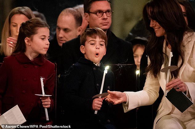 Kate smiles as Louis blows out his candle during last year's service at Westminster Abbey