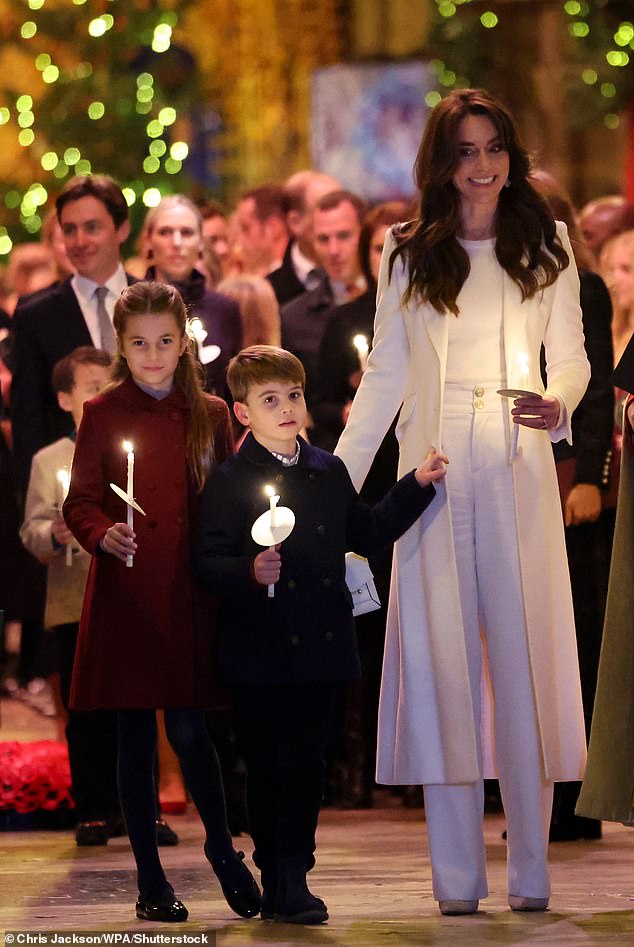 Kate with Charlotte and Louis holding candles during the service