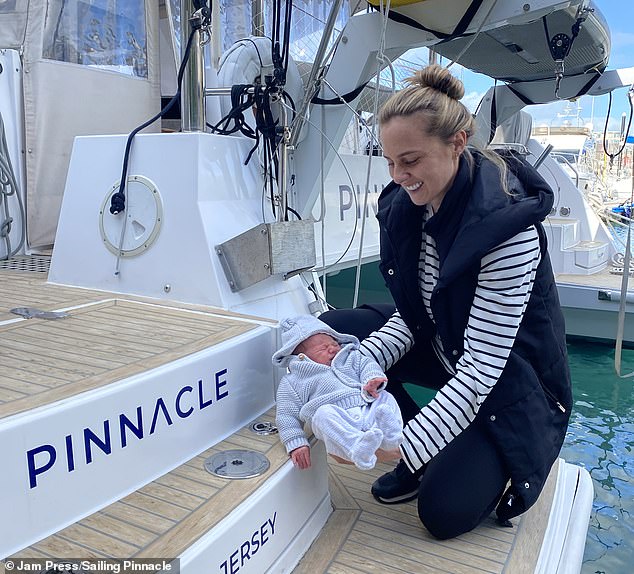 Stephanie pictured with baby Roux aboard the Pinnacle sailboat. The couple has two children together.