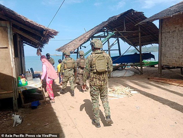 Just weeks before he was kidnapped, Eastman posted on a Facebook livestream that he was afraid to live in the area. Pictured: FBI agents join the search.