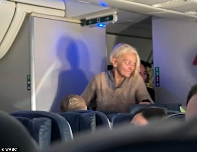 Passengers filmed her throughout the nightmarish flight and were caught going back and forth between the plane's bathrooms because she didn't have a seat.