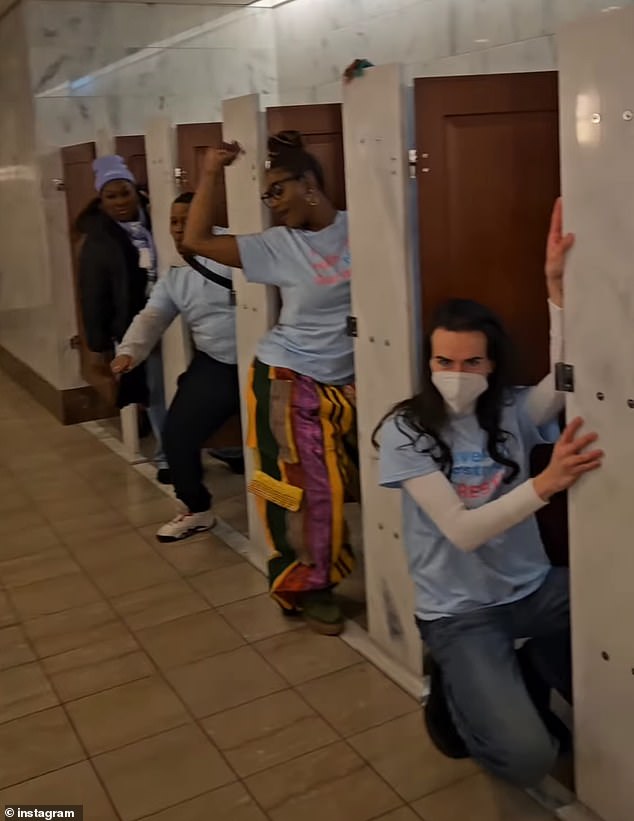 The group of protesters, including trans actress James Rose (right), danced to Meeting in the Ladies room by Klymaxx.