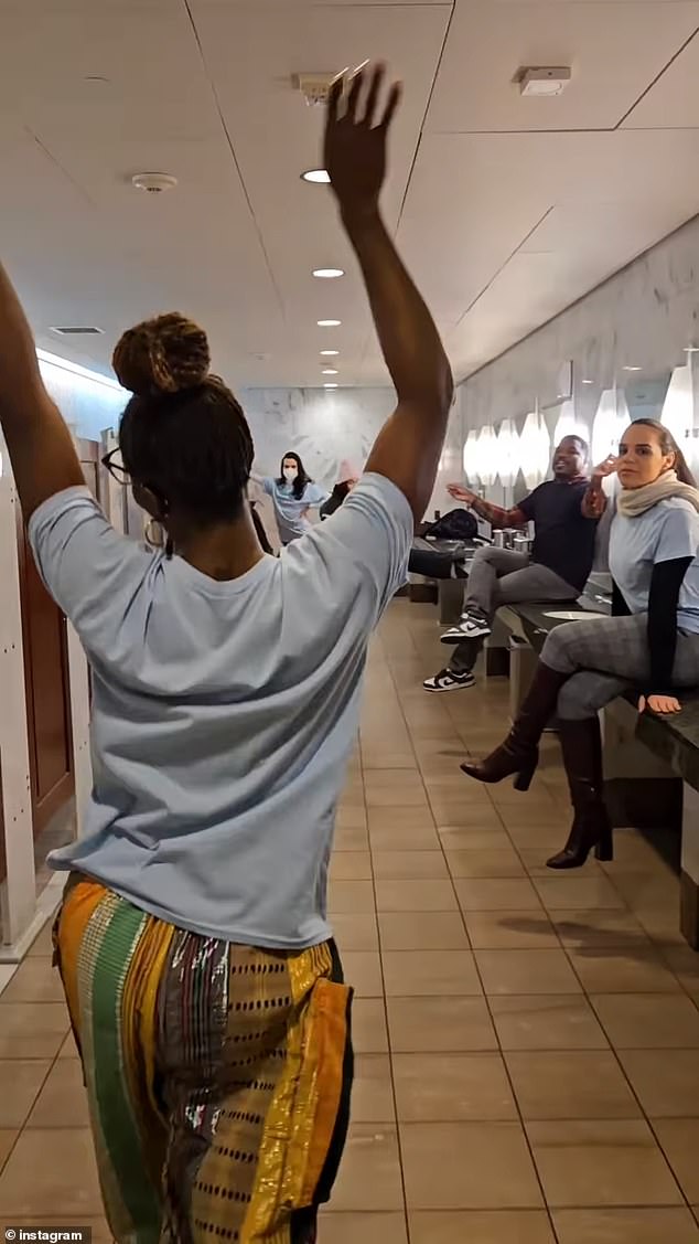 Video of the demonstration begins with a shot of the interior of the Capitol building entrance and then cuts to a nearby bathroom filled with a dancing group.