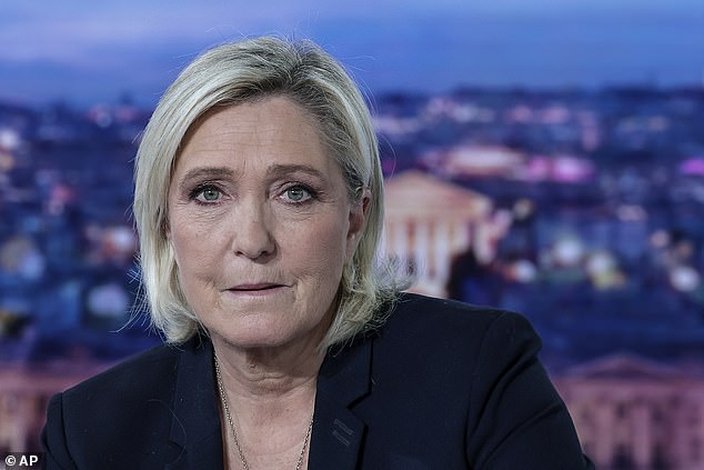 French far-right leader Marine Le Pen poses before an interview on French television channel TF1, in Boulogne-Billancourt, outside Paris, Wednesday, December 4, 2024.