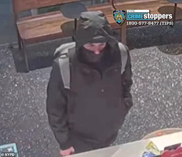 With the suspect at large, the NYPD has released several sets of photos of the shooter, including new photos of him standing at a counter with his face largely hidden by a balaclava.