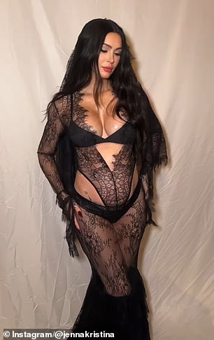 Megan shows off her baby bump in a sheer black lace bodysuit with black panties and a bra