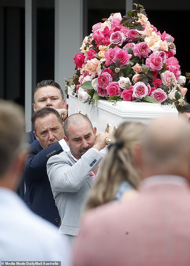 Bianca Jones' father Mark is seen carrying his daughter's coffin covered in pink roses. Holly Bowles' father is seen behind him.