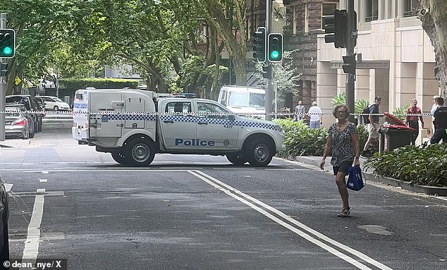 Police cordoned off Macleay Street in Potts Point and the area around the Commonwealth Bank branch on Friday morning.