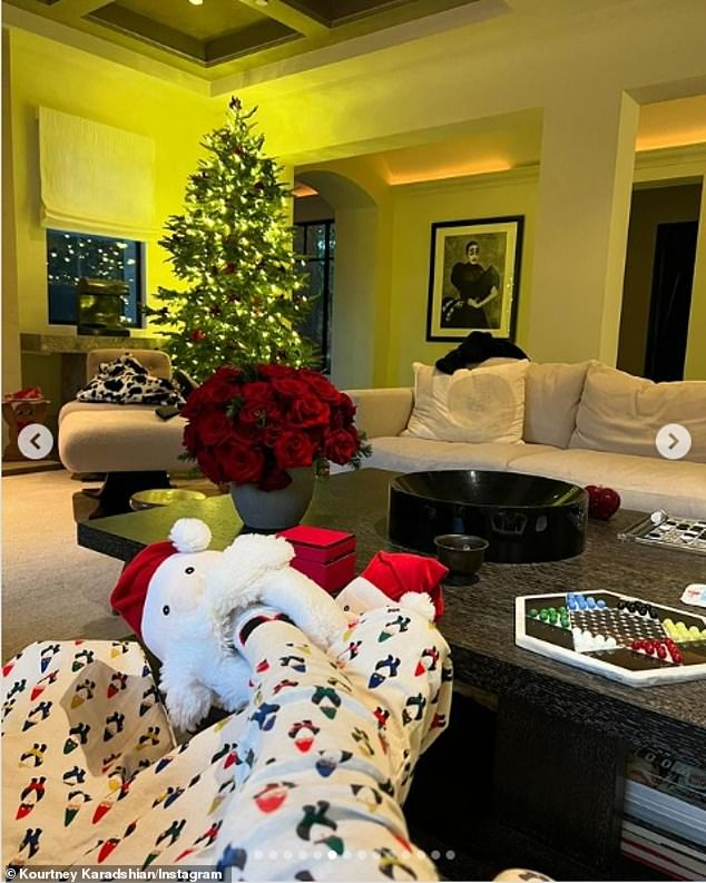 Kourtney also showed off her Santa slip-on shoes.