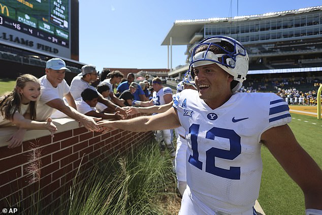 Retzlaff, 12, celebrates with fans after beating Baylor in Waco, Texas on September 28