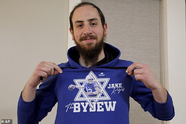 Rabbi Chaim Zippel shows his "BY Jew" sweatshirt featuring Brigham Young University's first Jewish quarterback, Jake Retzlaff